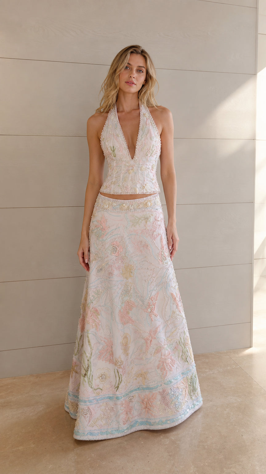 Ivory embroidered halter crop top and maxi skirt set shown from the front