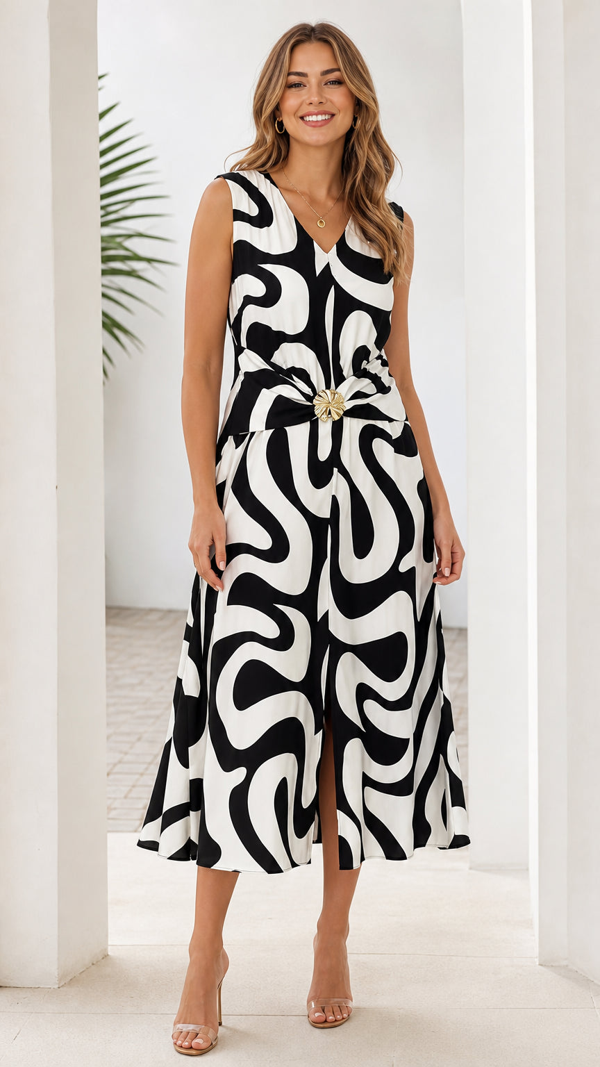 Front view of black and white abstract print midi dress on model