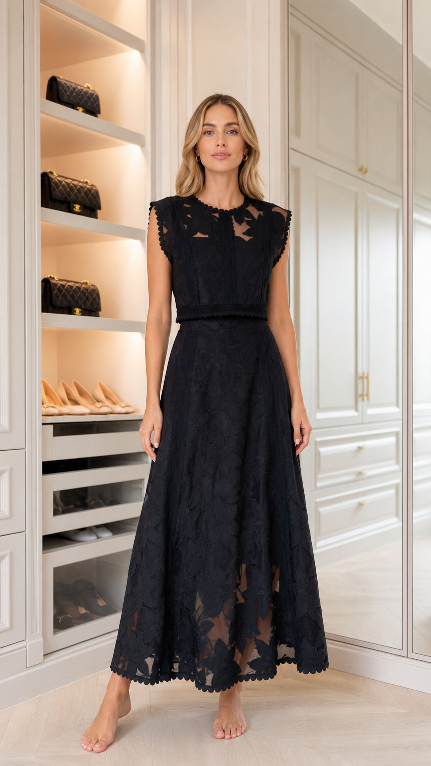 Front view of woman wearing black embroidered maxi dress