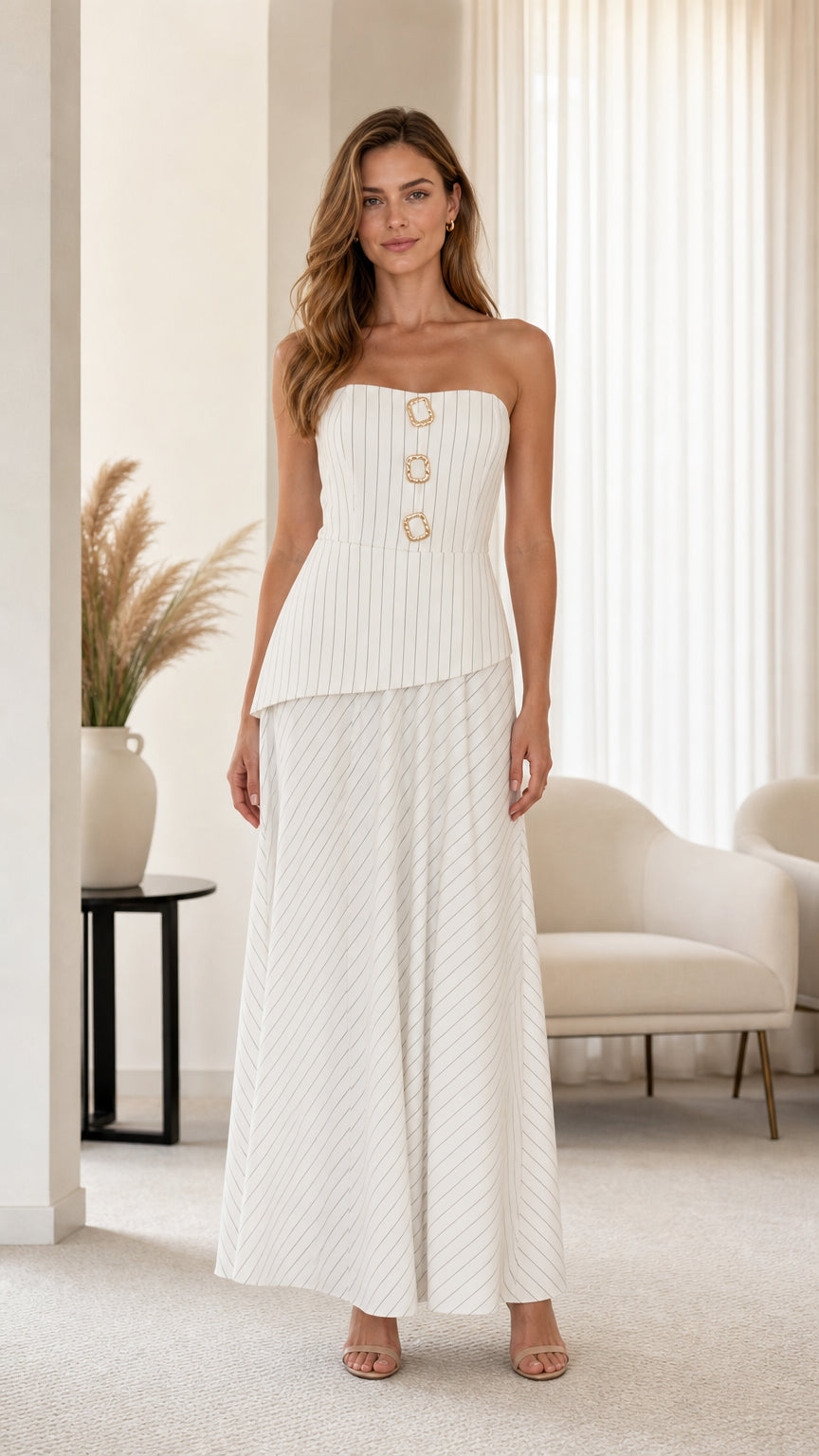 Front view of model wearing white striped strapless peplum top and wide leg pants set