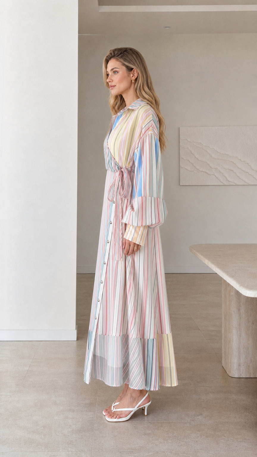 Side profile of model in multi stripe wrap maxi dress