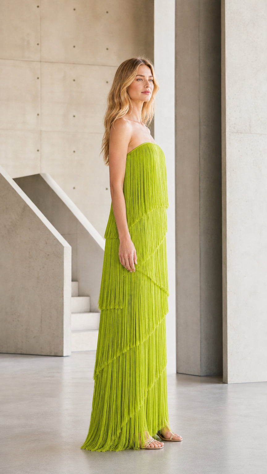 Side profile view of chartreuse fringe maxi dress