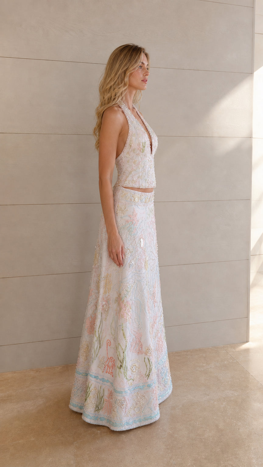 Ivory embellished two-piece maxi skirt outfit shown from the side