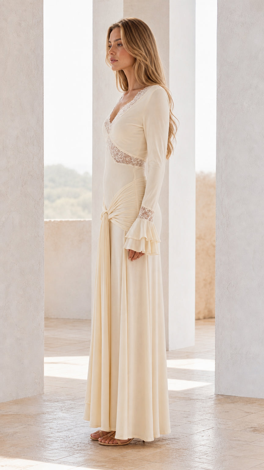 Side profile view of ivory maxi dress with knot detail