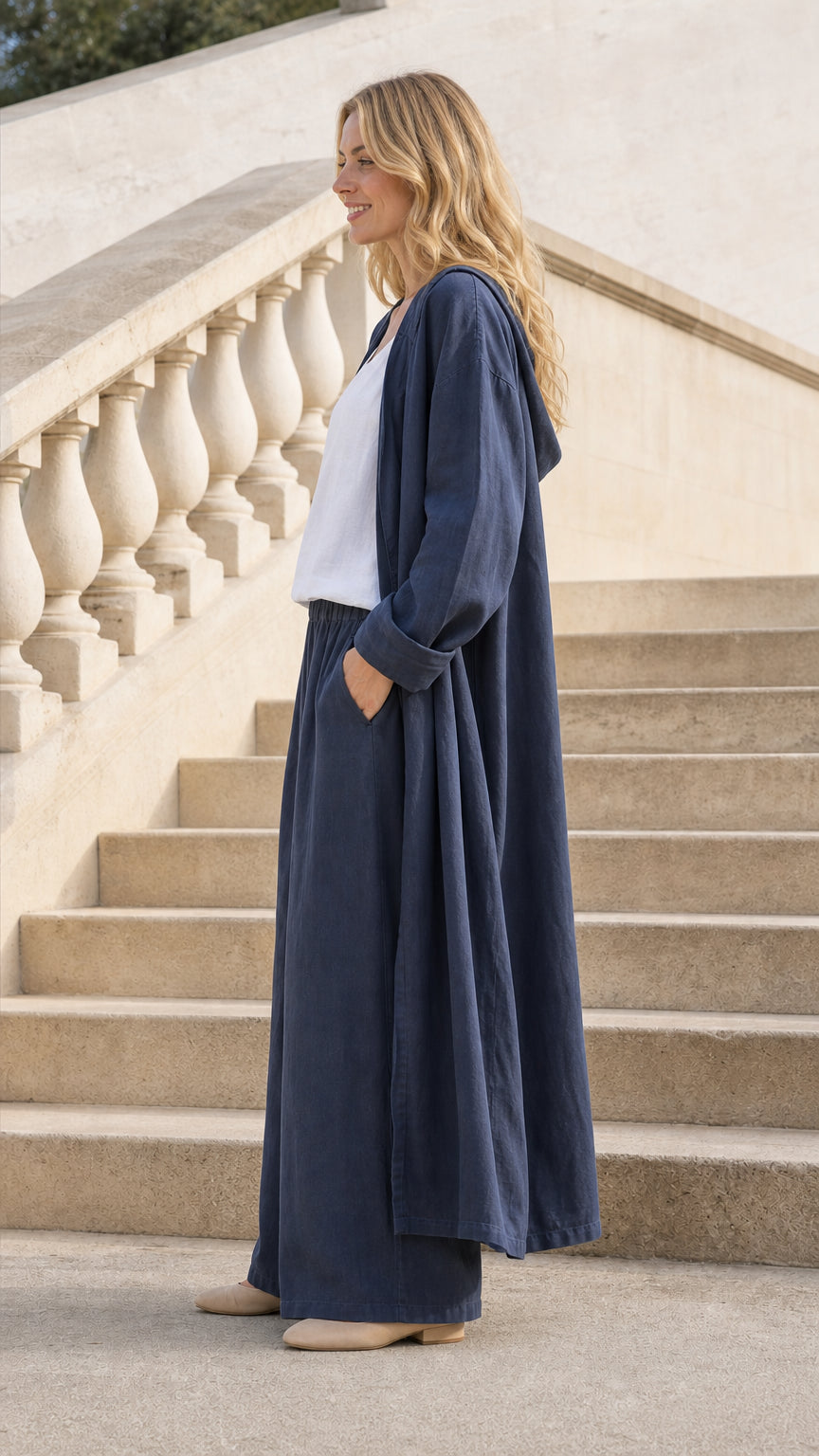 Side profile view of Navy Blue cardigan and pants set on steps
