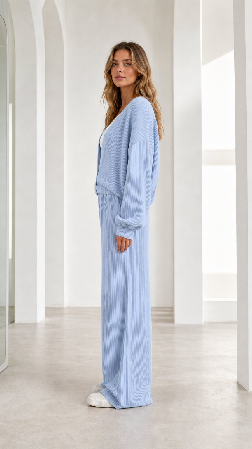 Side profile of woman in light blue lounge set