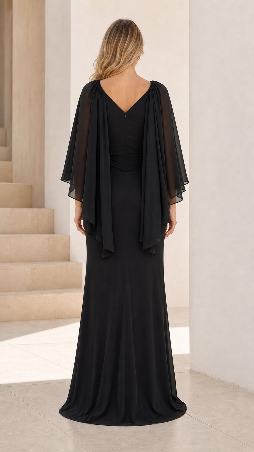 Back view of black formal dress with cape detail