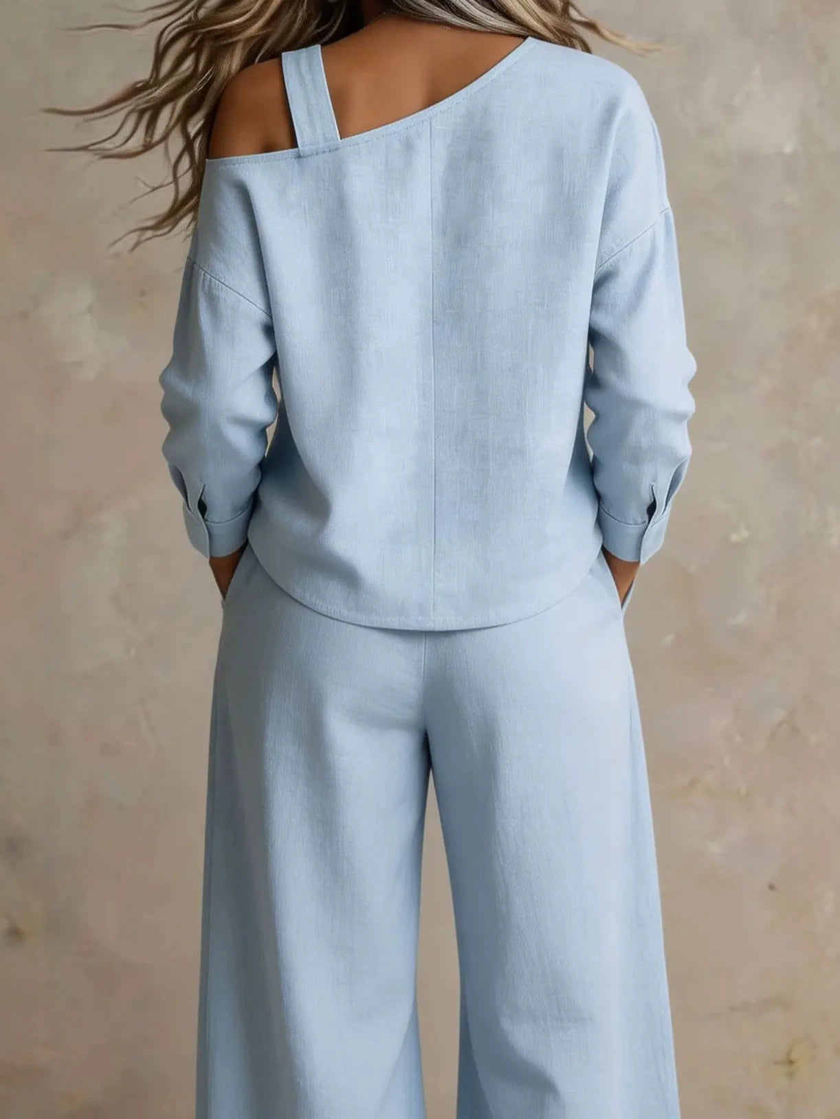 Back view of woman wearing light blue lounge set