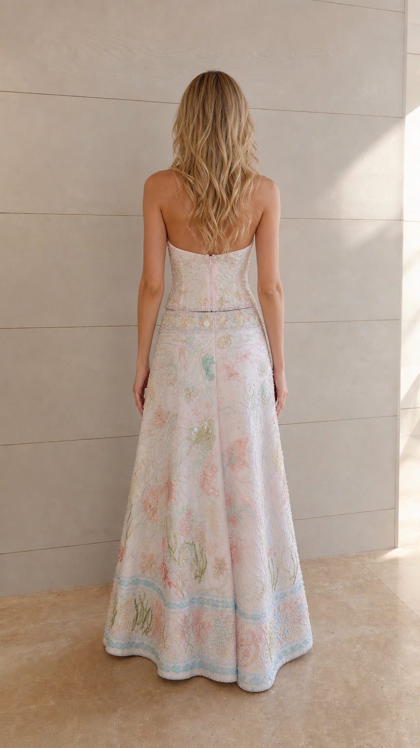 Back view of ivory halter top and embroidered maxi skirt set