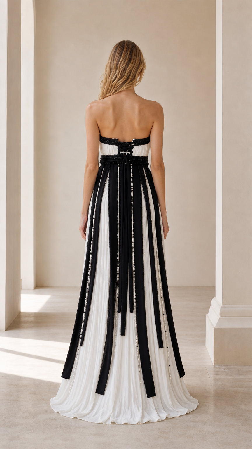 Back view showcasing laced corset detail on black and white evening gown