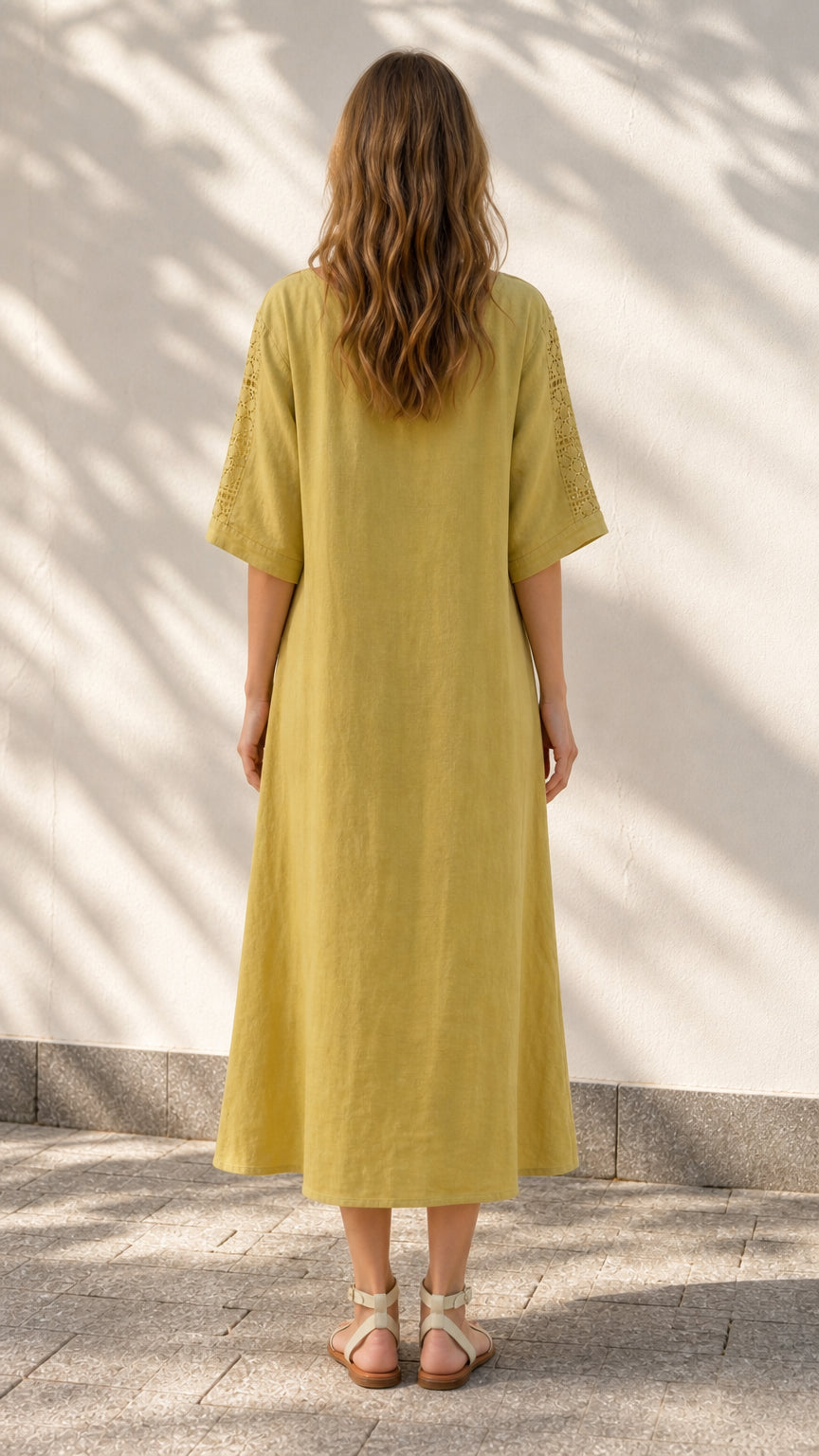 Back view of model in yellow midi dress