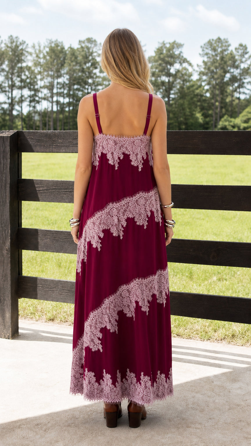 Back view of woman wearing burgundy sleeveless maxi dress