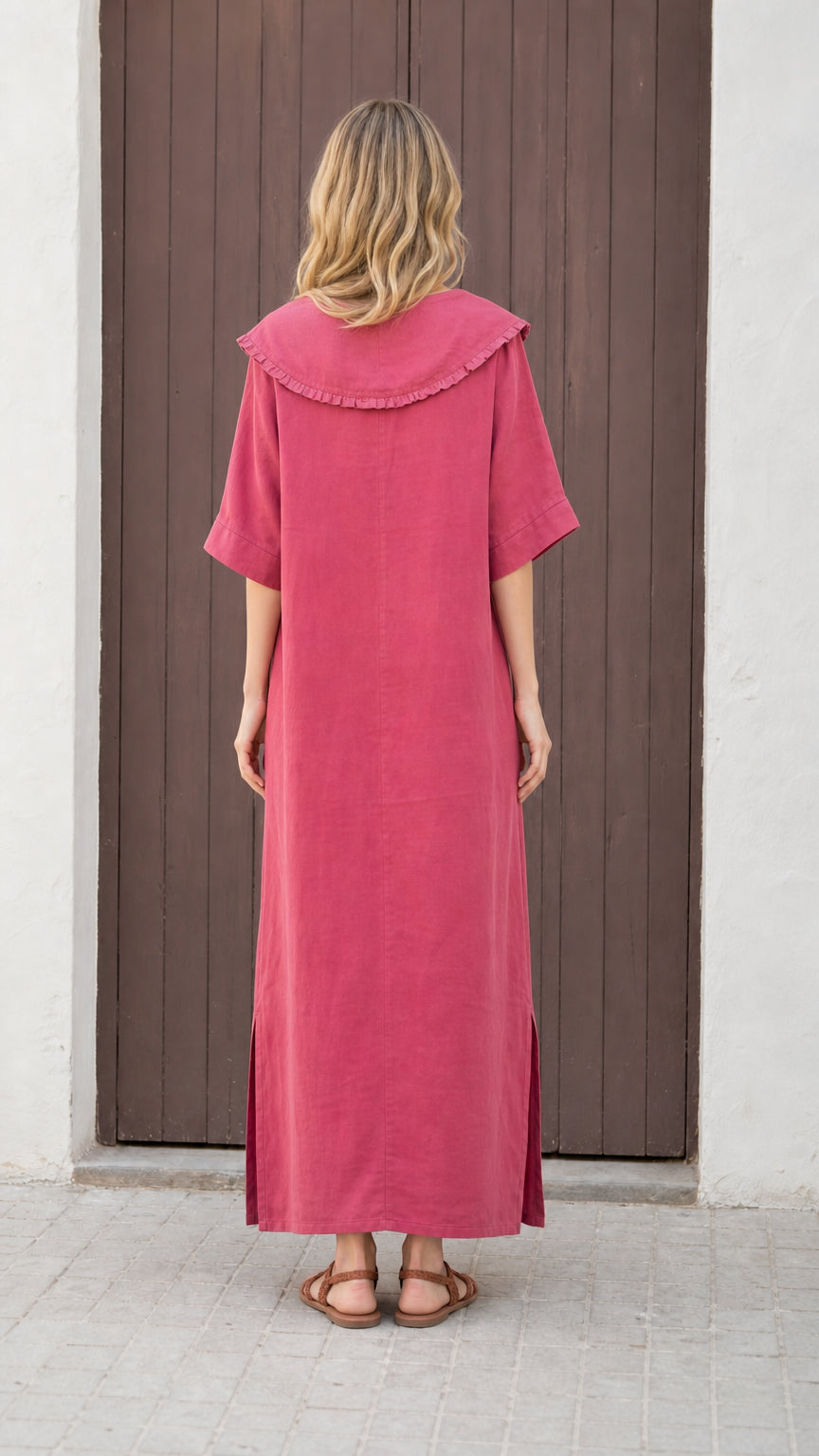 Back view of woman wearing rose pink dress showing collar detail