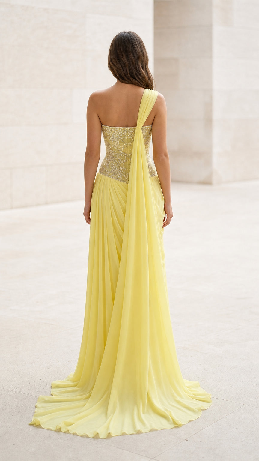 Back view of yellow evening gown with sweeping hem