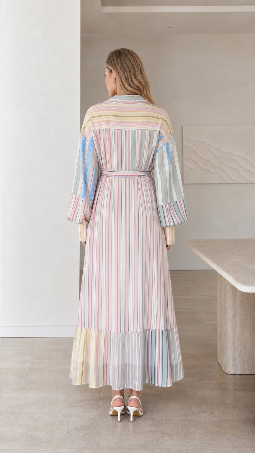 Back view of model in multi stripe maxi dress