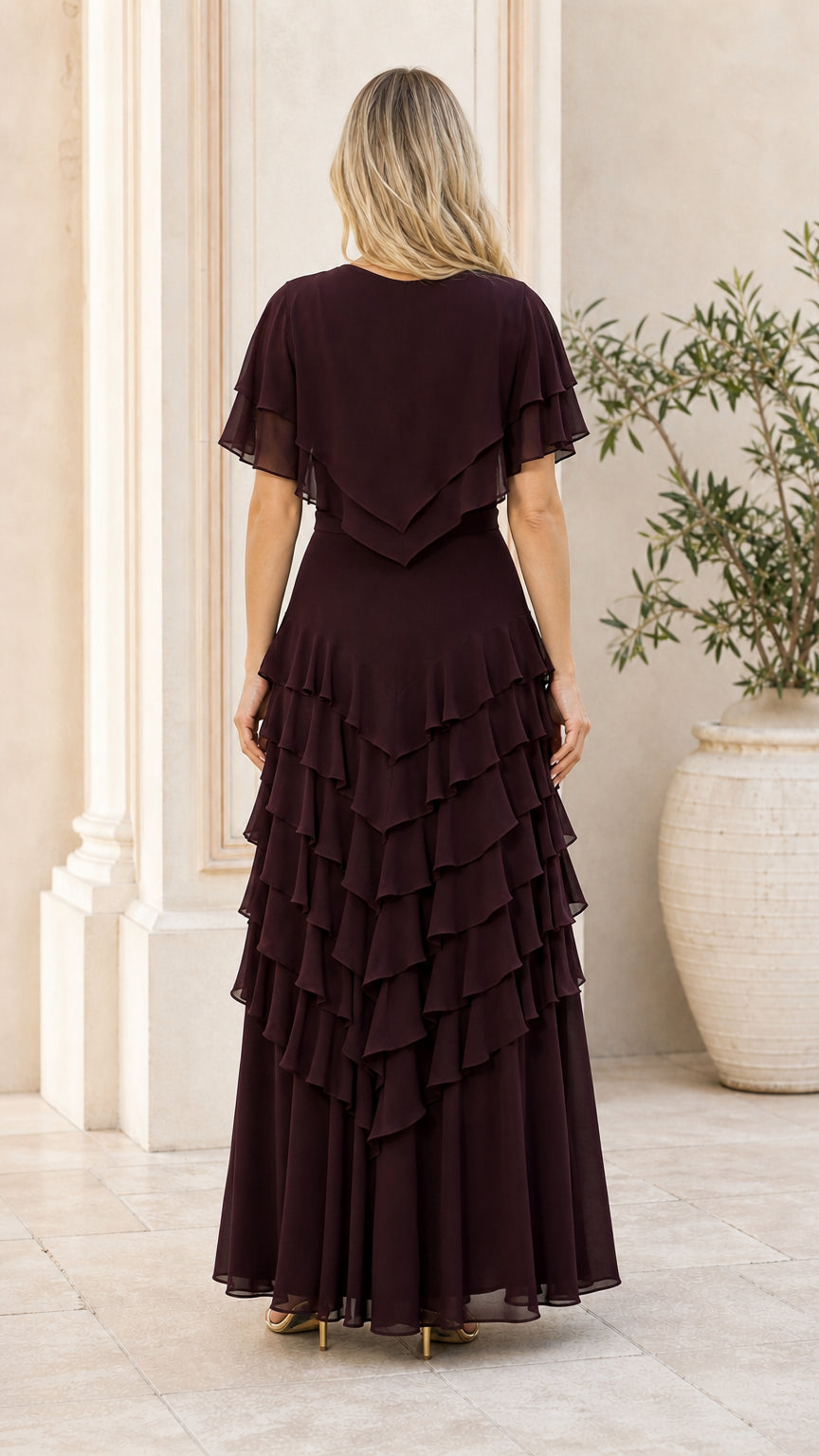 Back view of model wearing burgundy tiered maxi dress