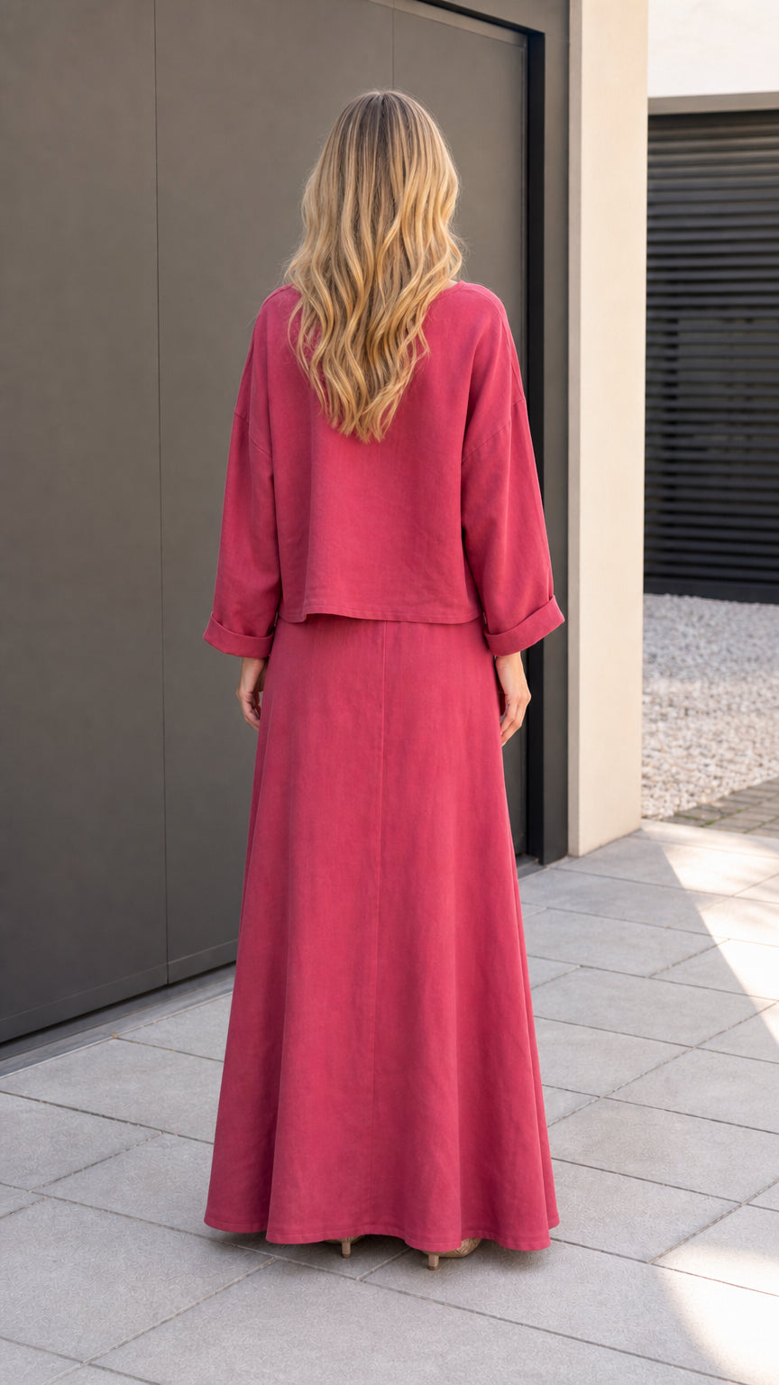 Back view of model showcasing flowing maxi skirt