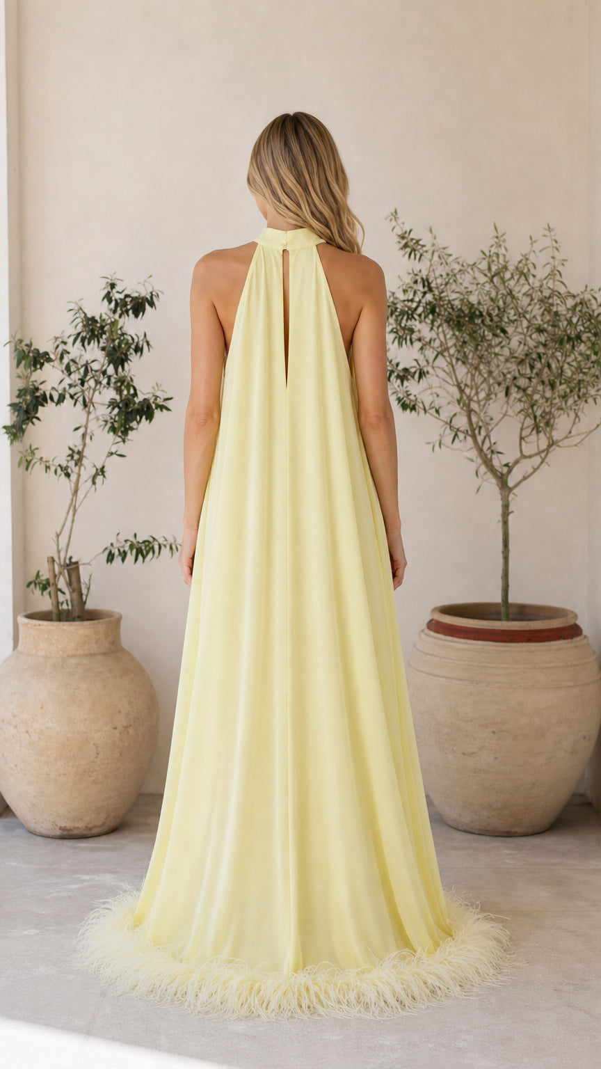 Back view of yellow feather maxi dress