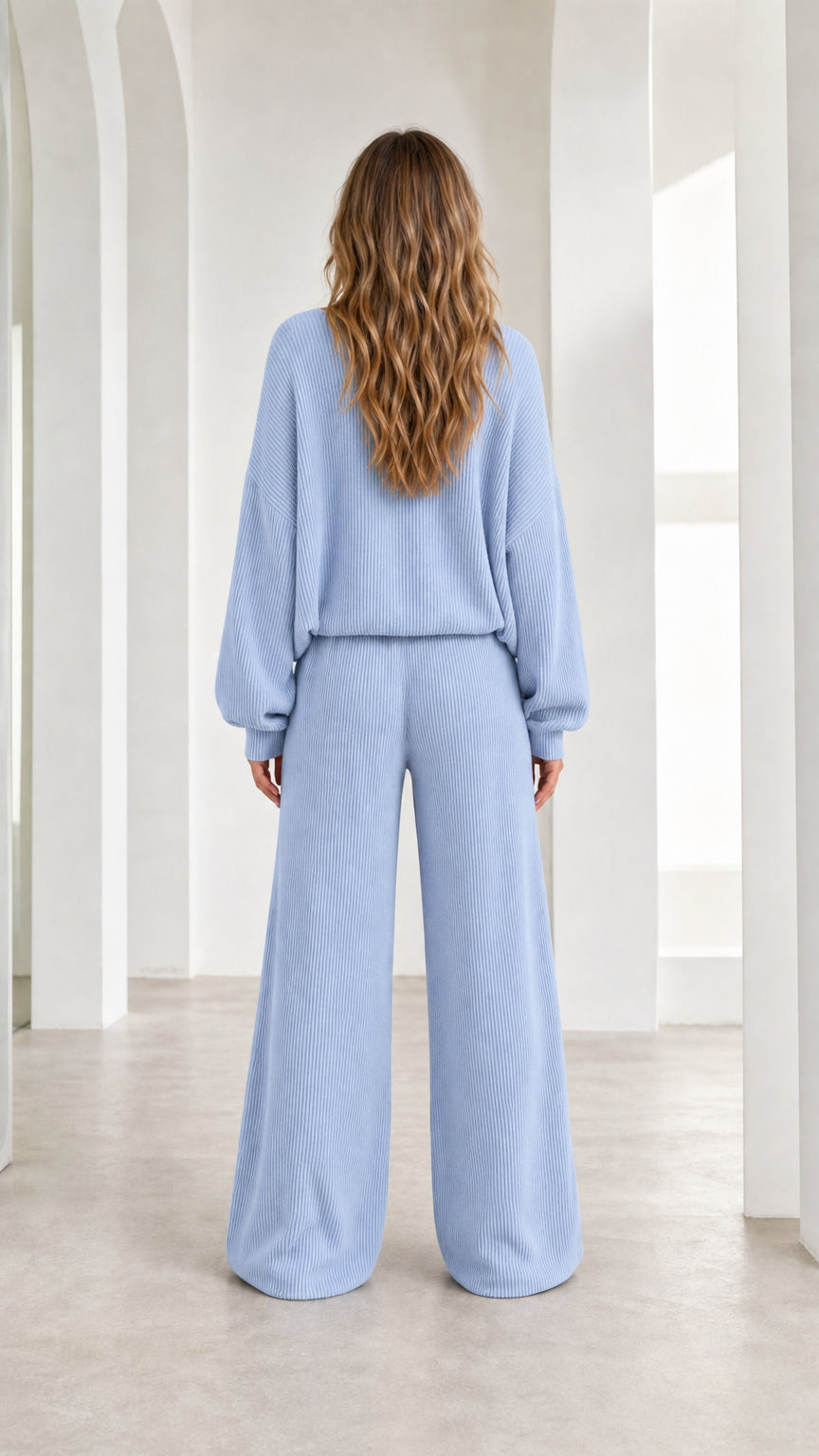 Back view of woman wearing light blue knit lounge set