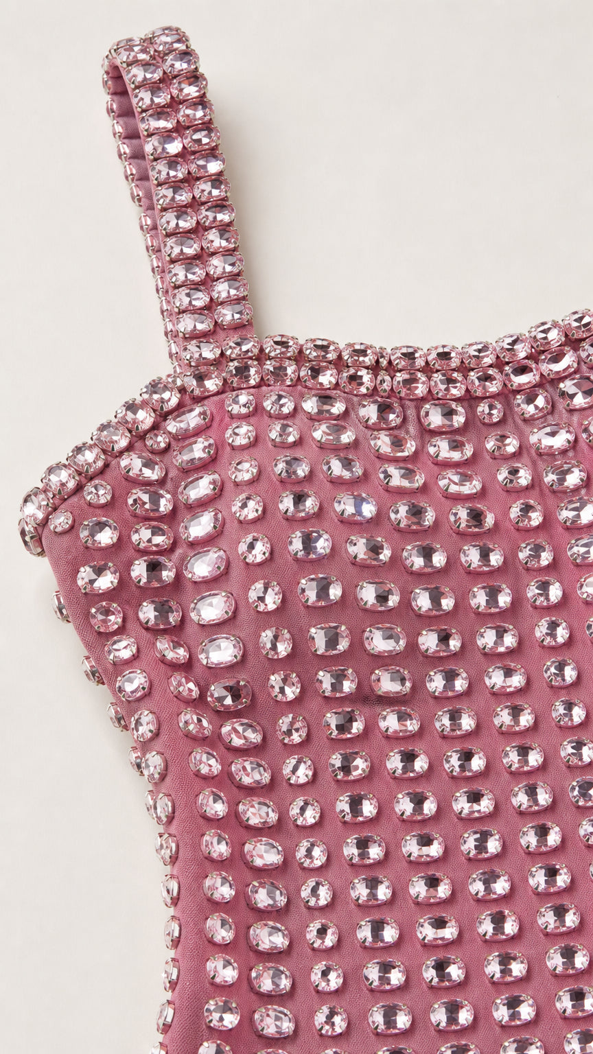 Close-up detail of rhinestone straps and neckline
