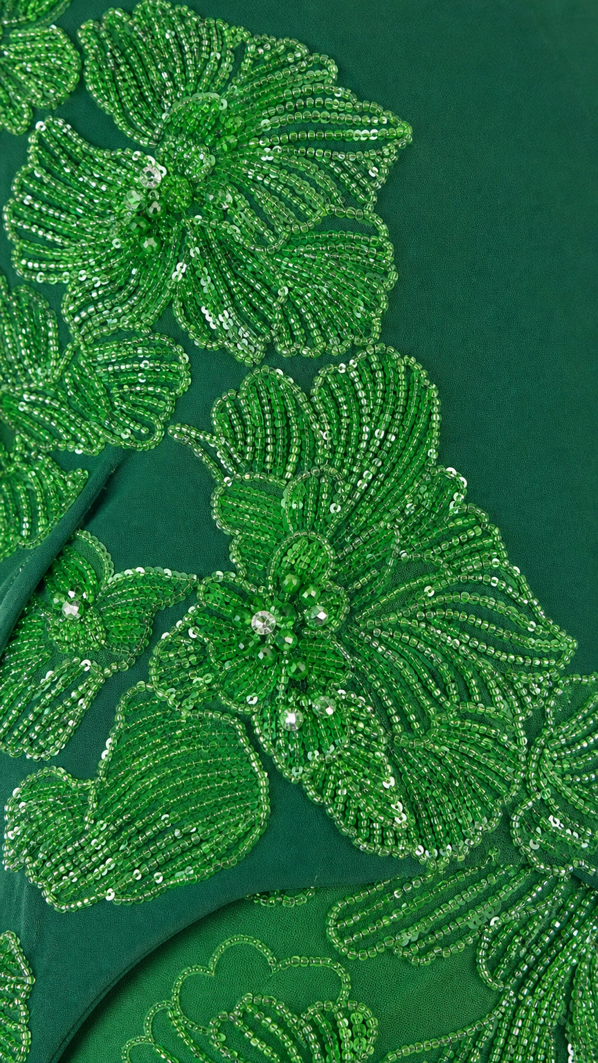 Close-up of green sequined floral lace embroidery
