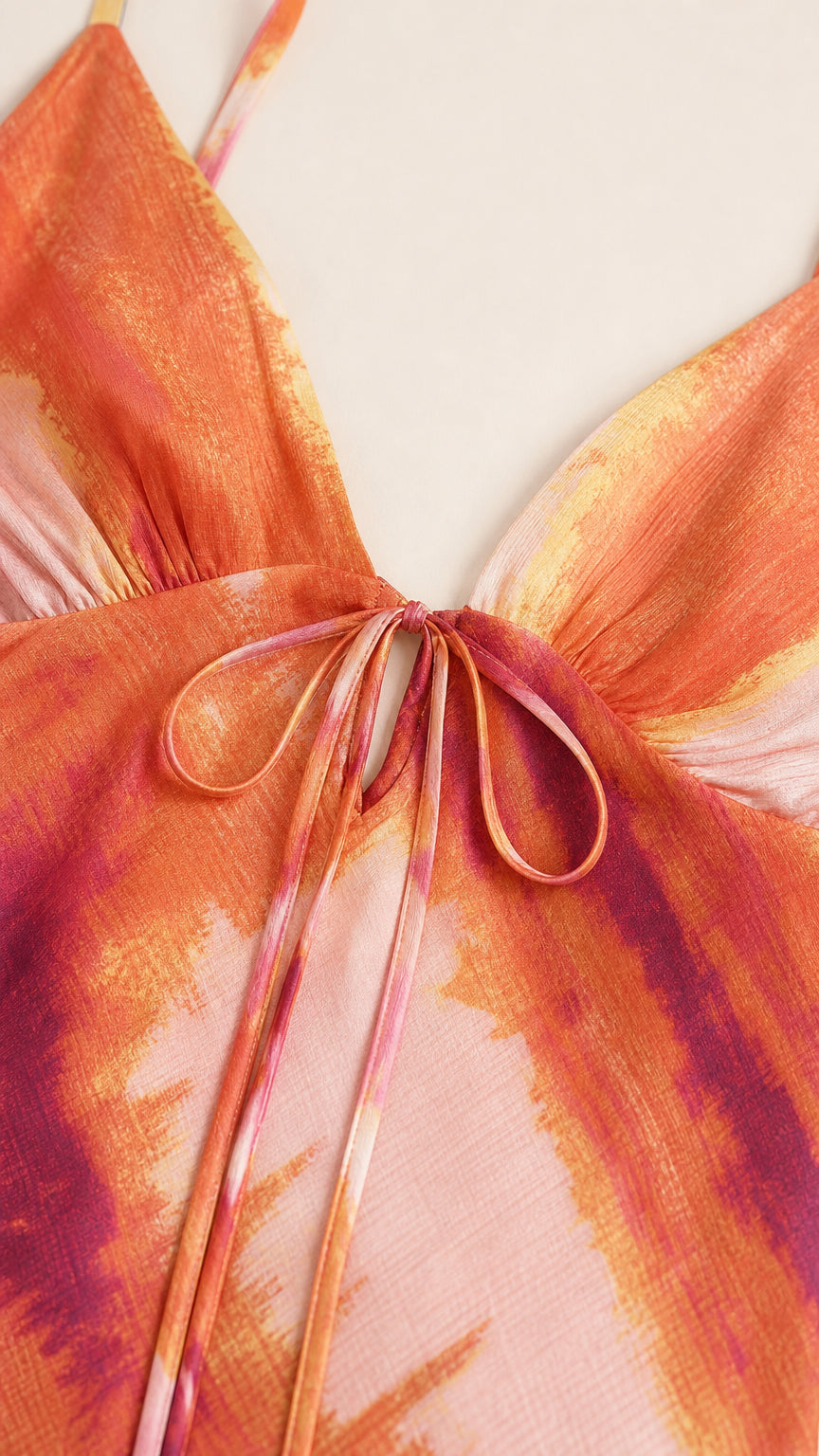 Close-up of V-neckline and tie detail