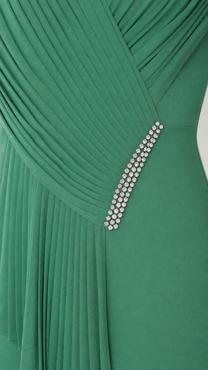 Close-up of bodice pleating and rhinestone waist trim
