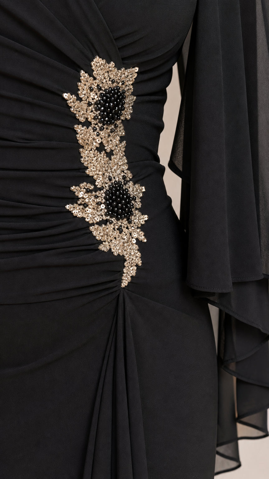 Close-up of sequin floral waist applique on black dress