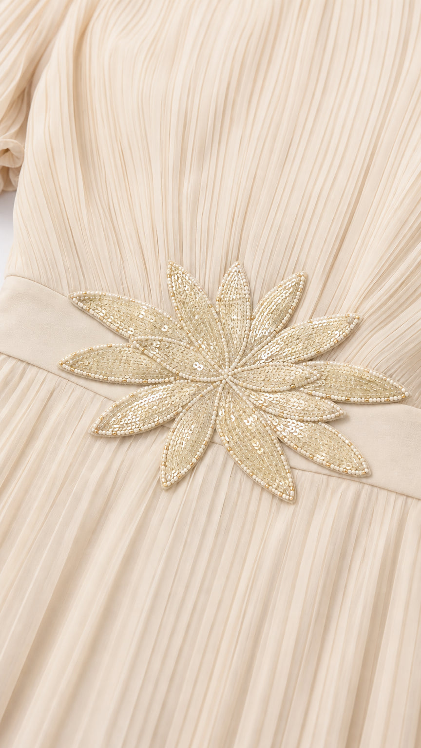 Close-up detail of the shimmering floral embroidery at the waist