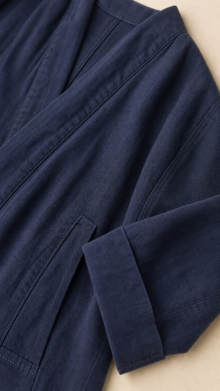 Close-up detail of the Navy Blue fabric, lapel, and sleeve cuff