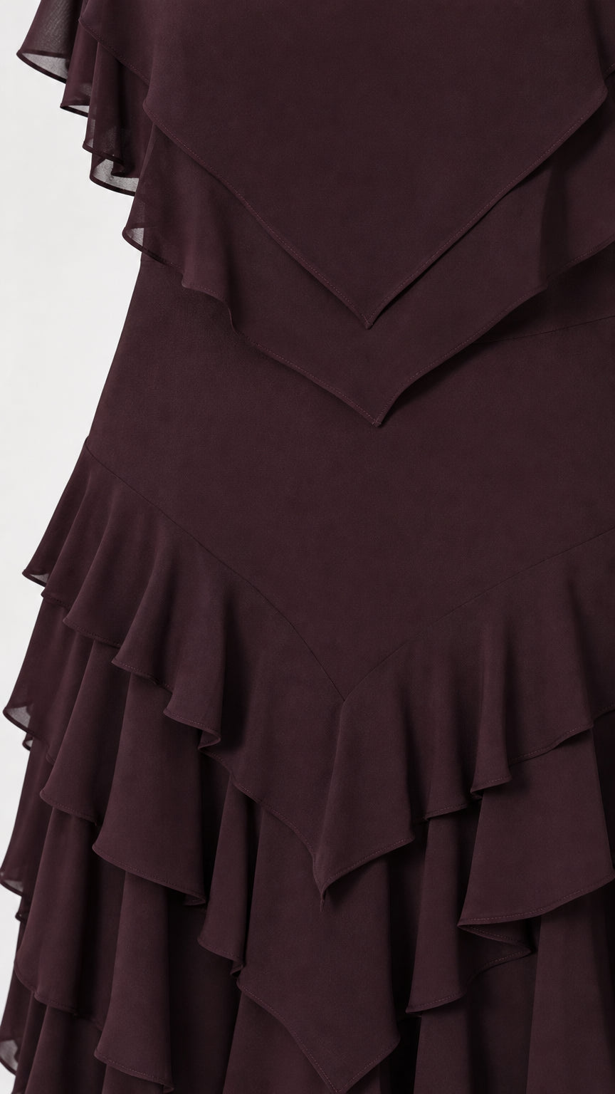 Close-up detail of layered ruffles on burgundy dress