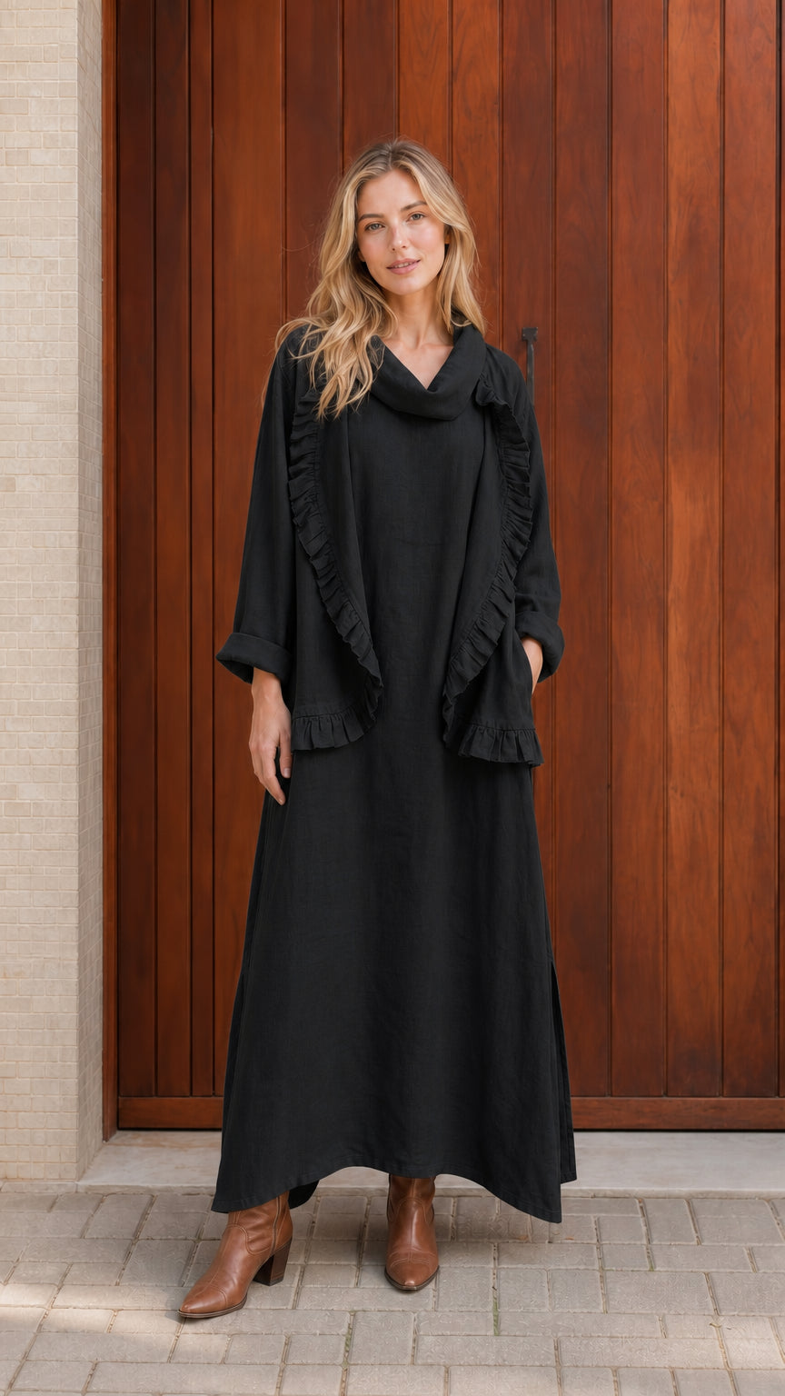 Model wearing black ruffled cowl neck top and maxi skirt set