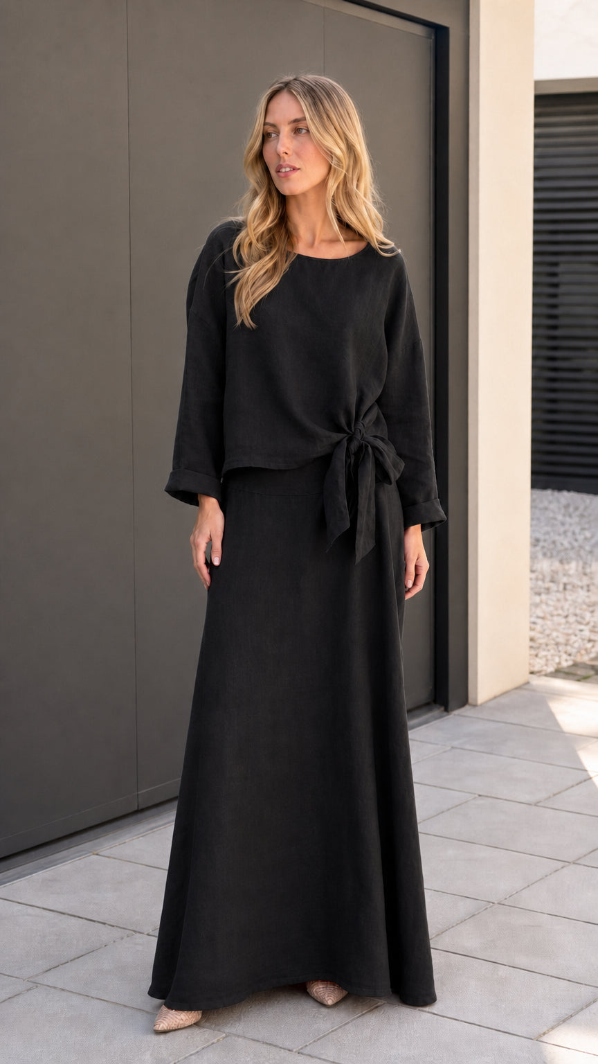 Model wearing black two-piece matching set