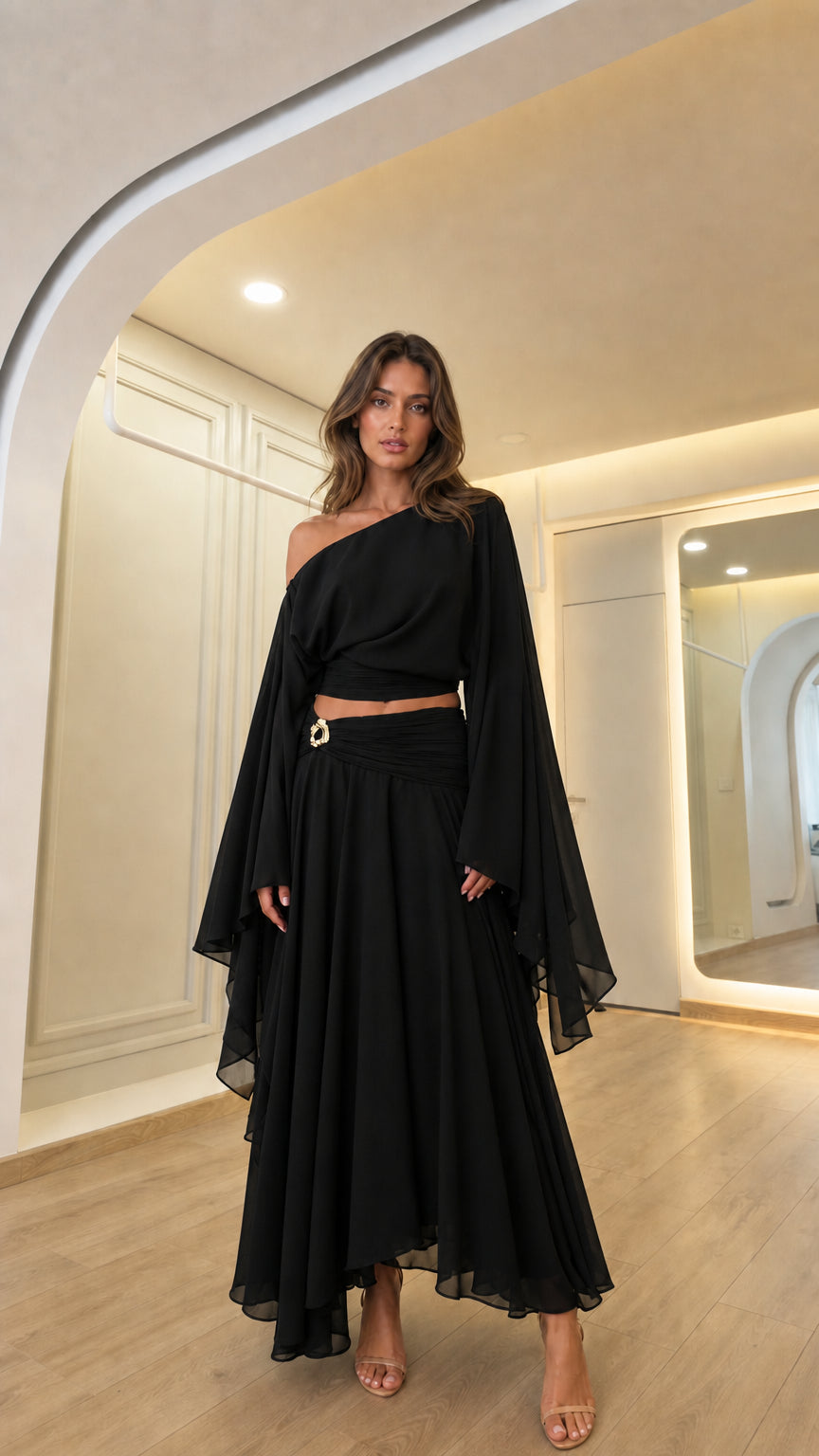 Woman wearing the black color variant of the off-shoulder two-piece set