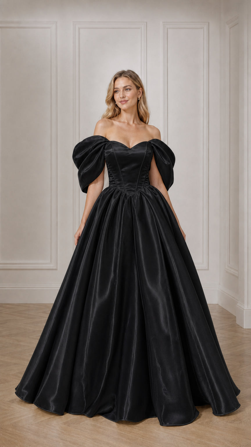 Full view of woman in black off-the-shoulder satin ball gown