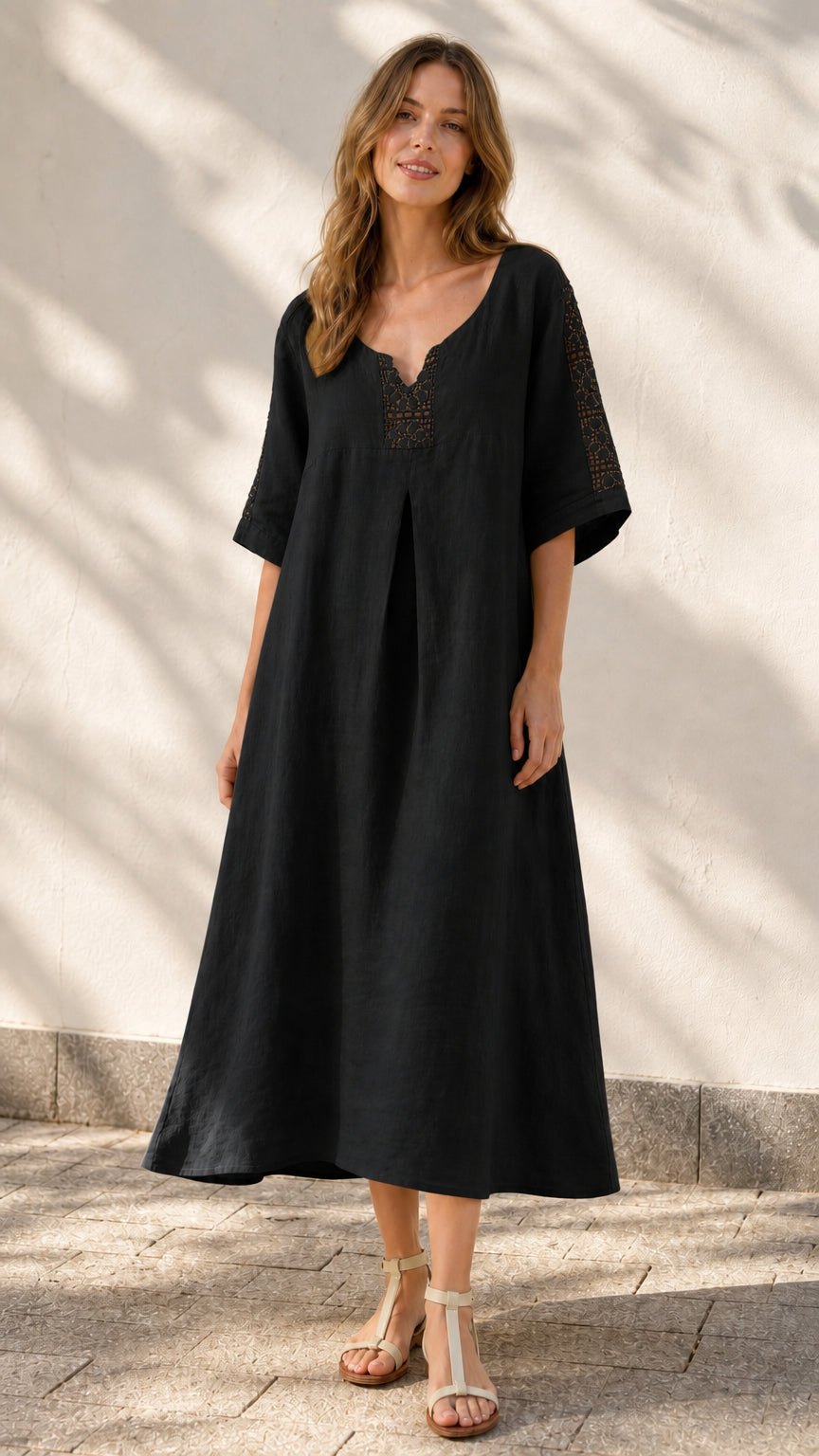 Front view of model wearing black midi dress
