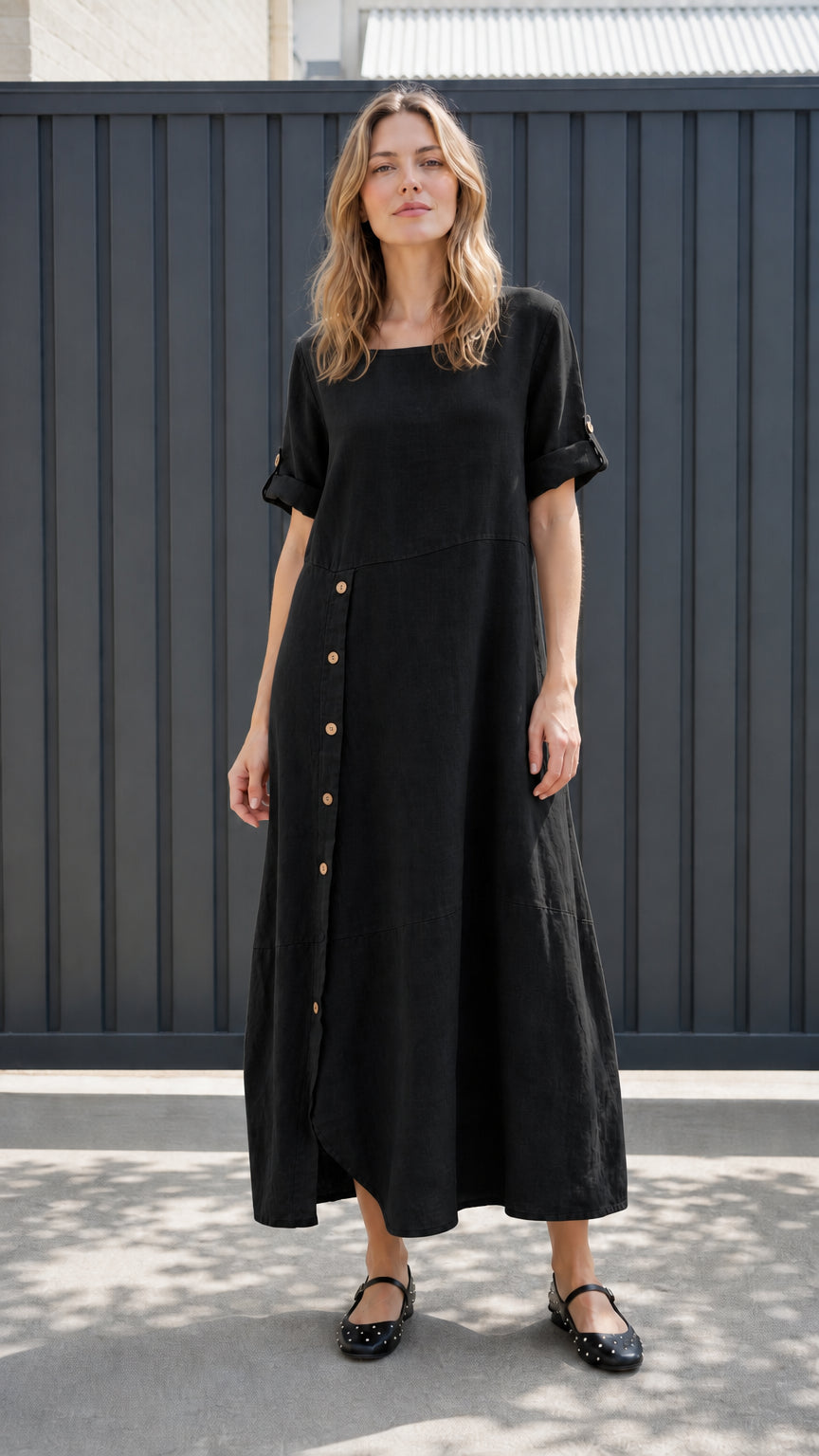 Front view of black asymmetrical button-front maxi dress