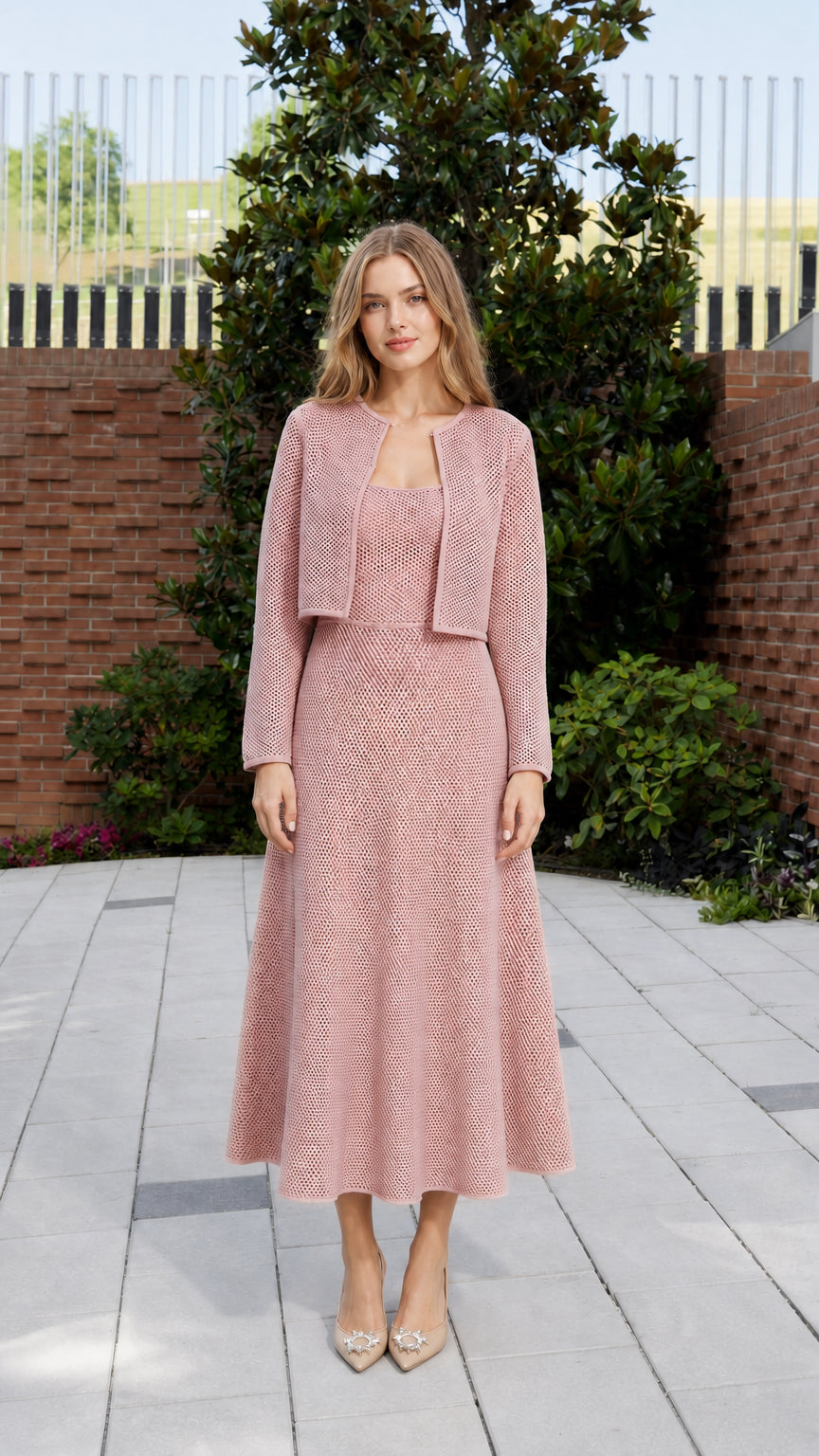 Full front view of model in pink knit matching set