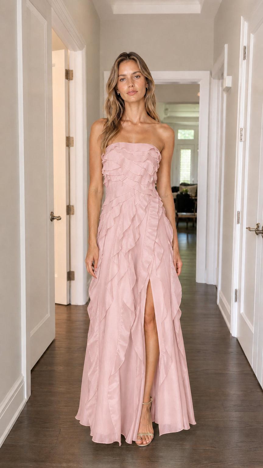 Model wearing blush pink strapless tiered ruffle maxi dress