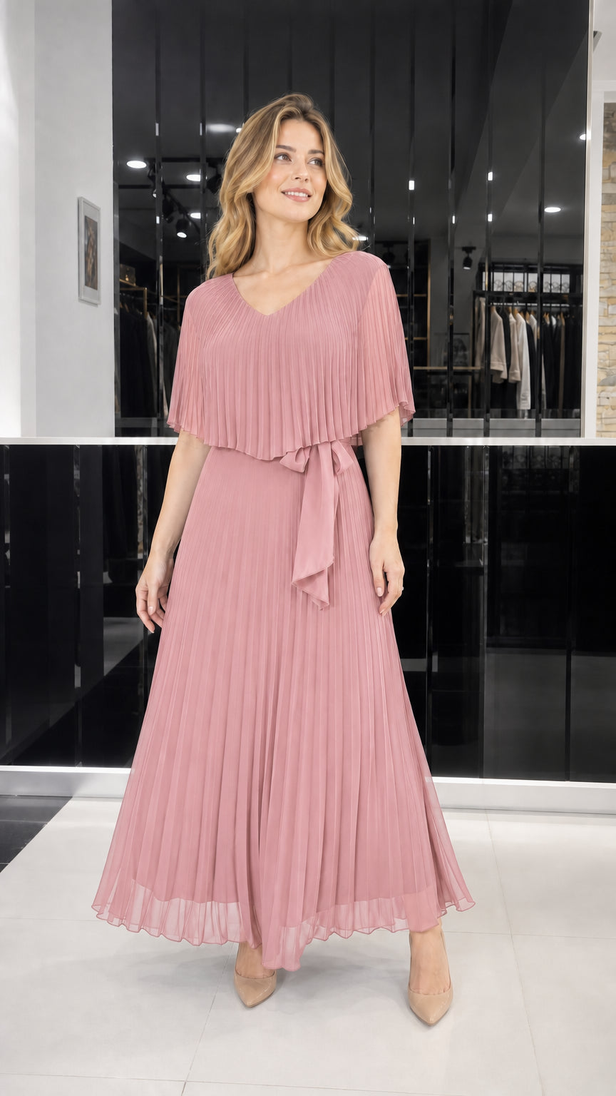 Model wearing dusty rose pleated cape overlay maxi dress