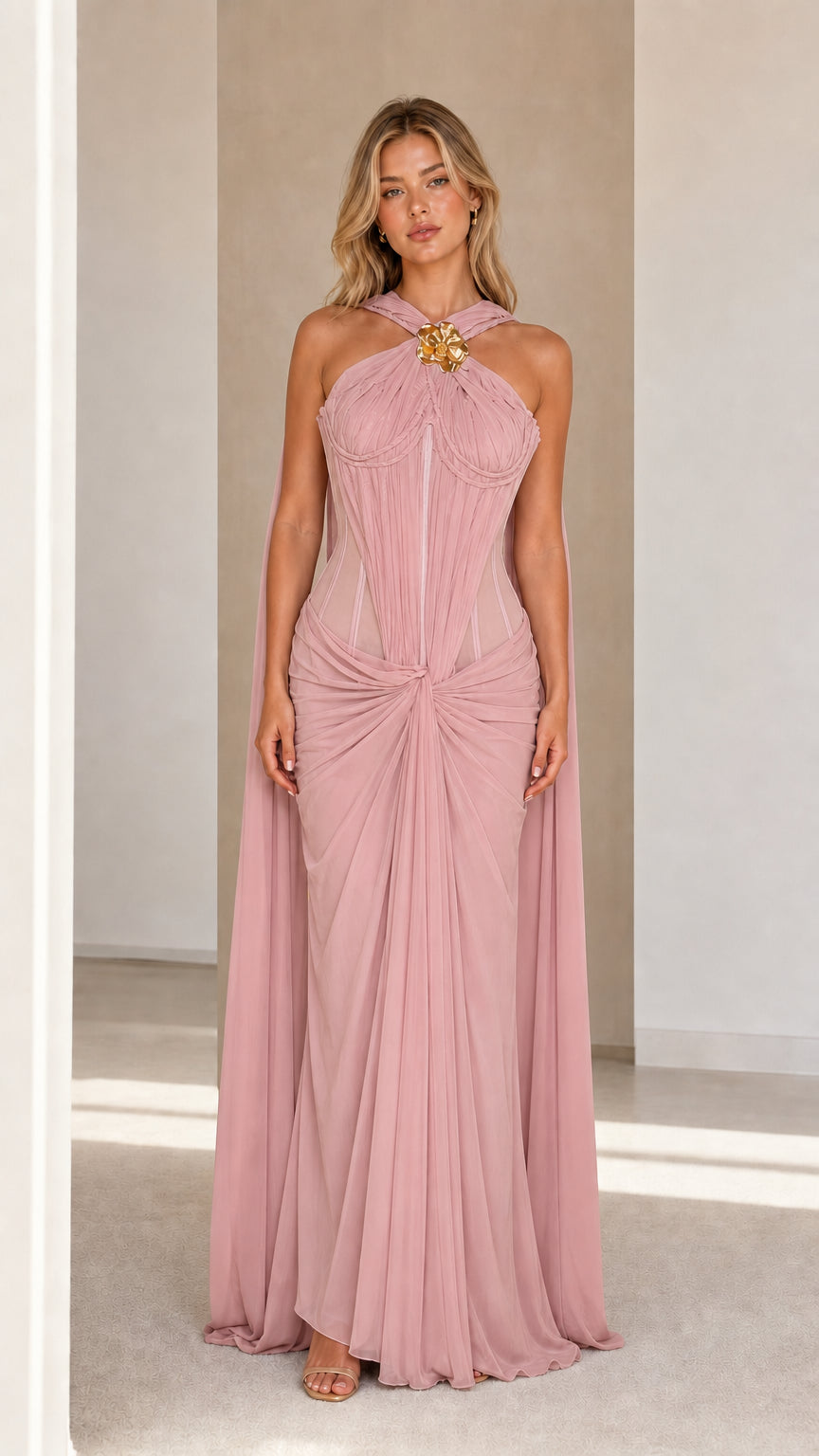 Model wearing pink evening cape maxi dress