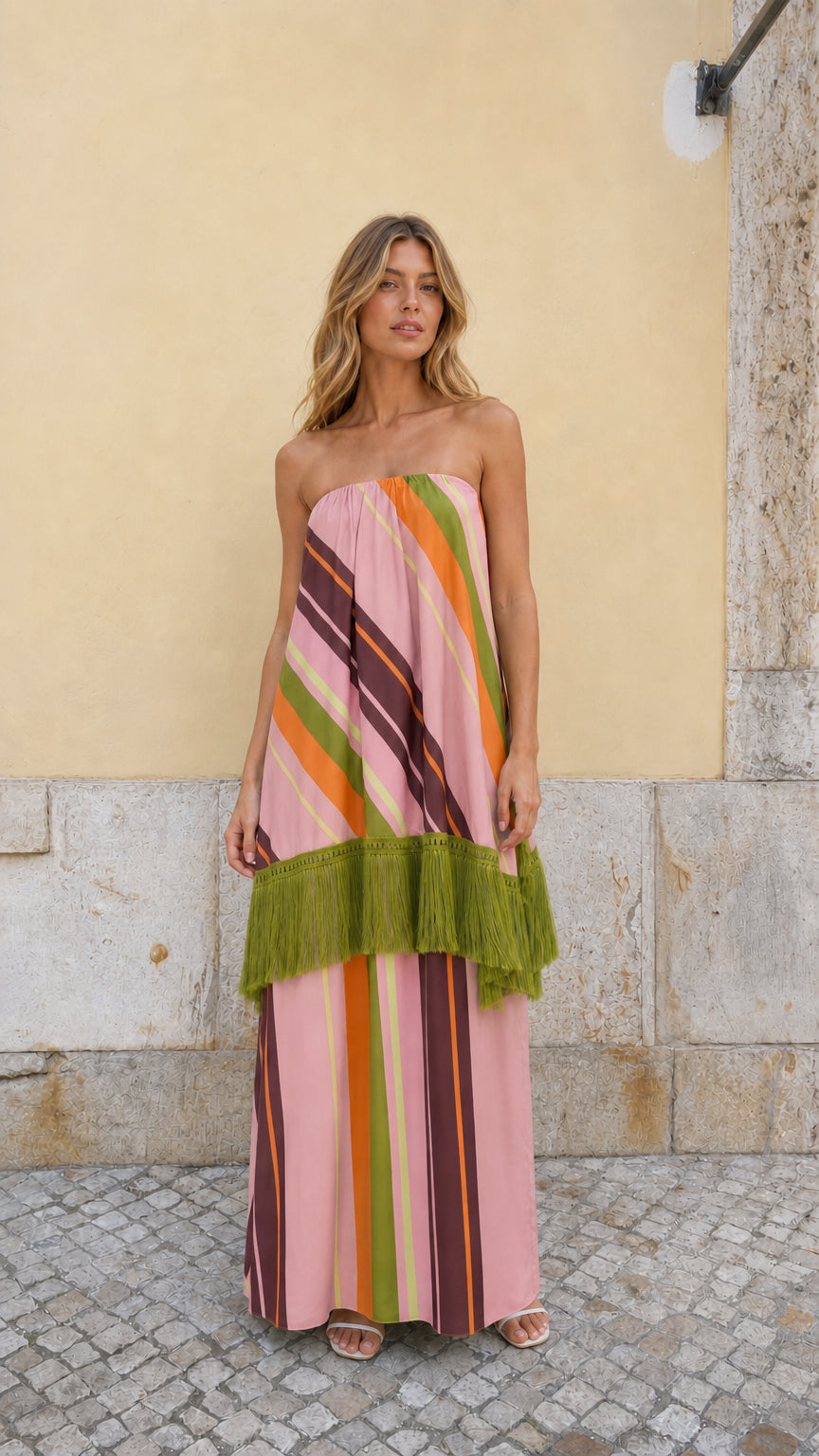 Front view of model wearing Pink Multi striped strapless fringe maxi dress