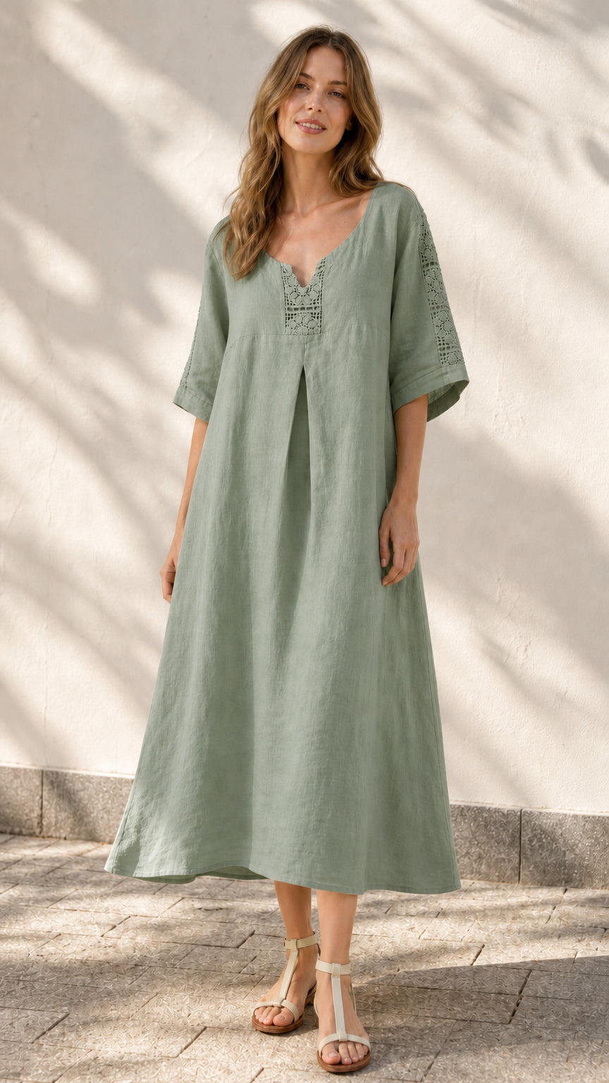 Front view of model wearing sage green midi dress