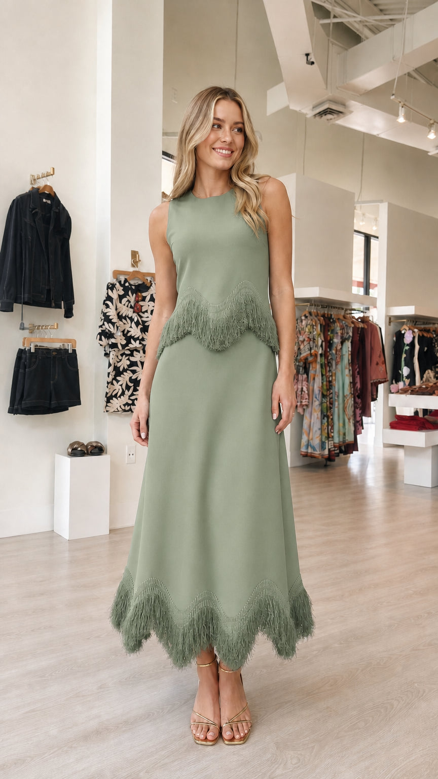 Model wearing sage green fringe midi dress