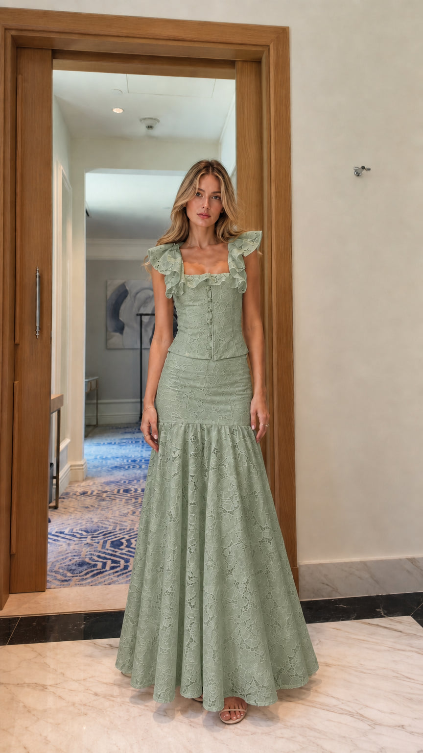Model wearing sage green lace crop top and mermaid maxi skirt set