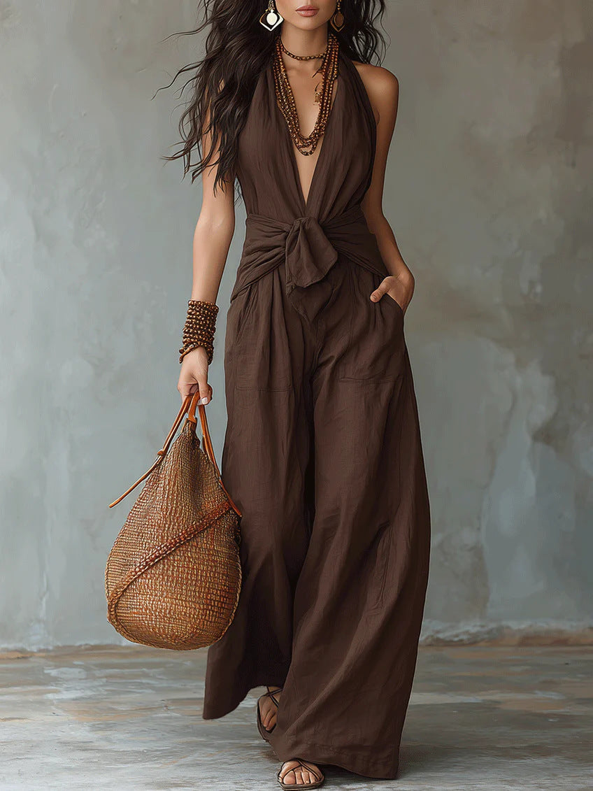 Model wearing brown halter wide leg jumpsuit showing full length