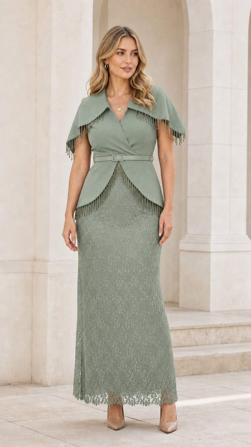 Front view of woman wearing green cape overlay lace evening dress