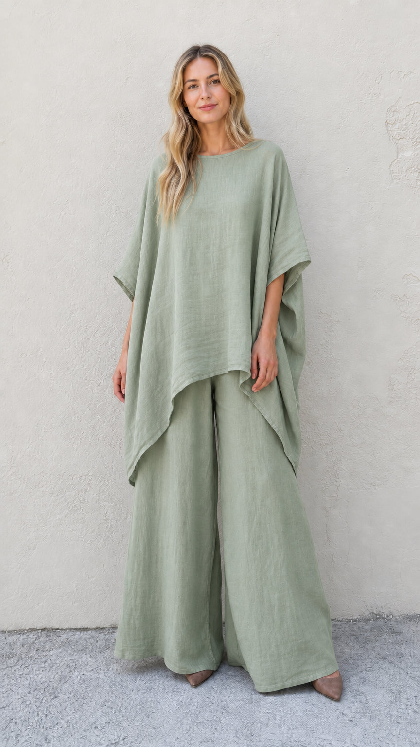 Woman wearing sage green two-piece poncho and wide leg pants set