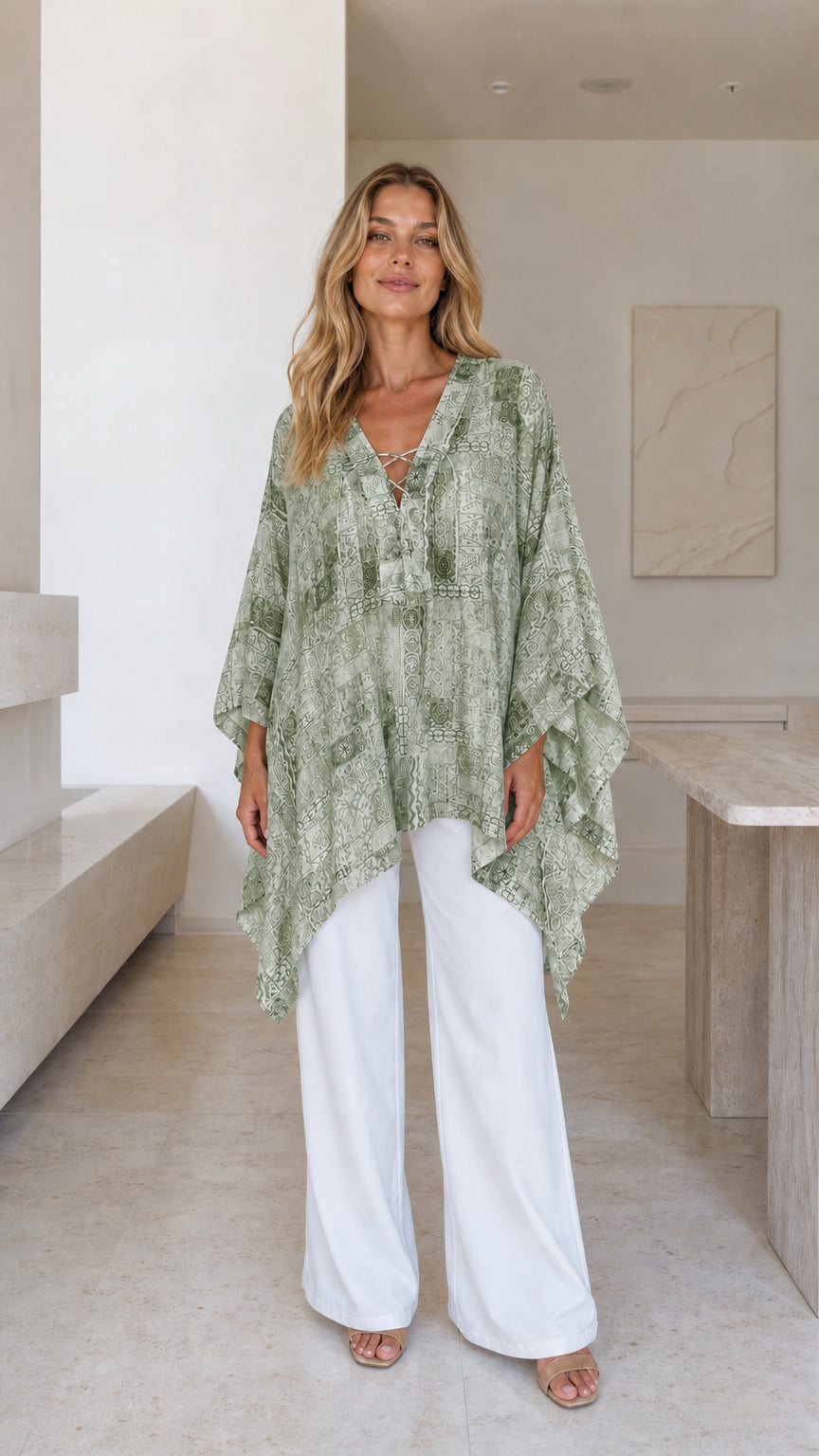 Model wearing green printed boho poncho top