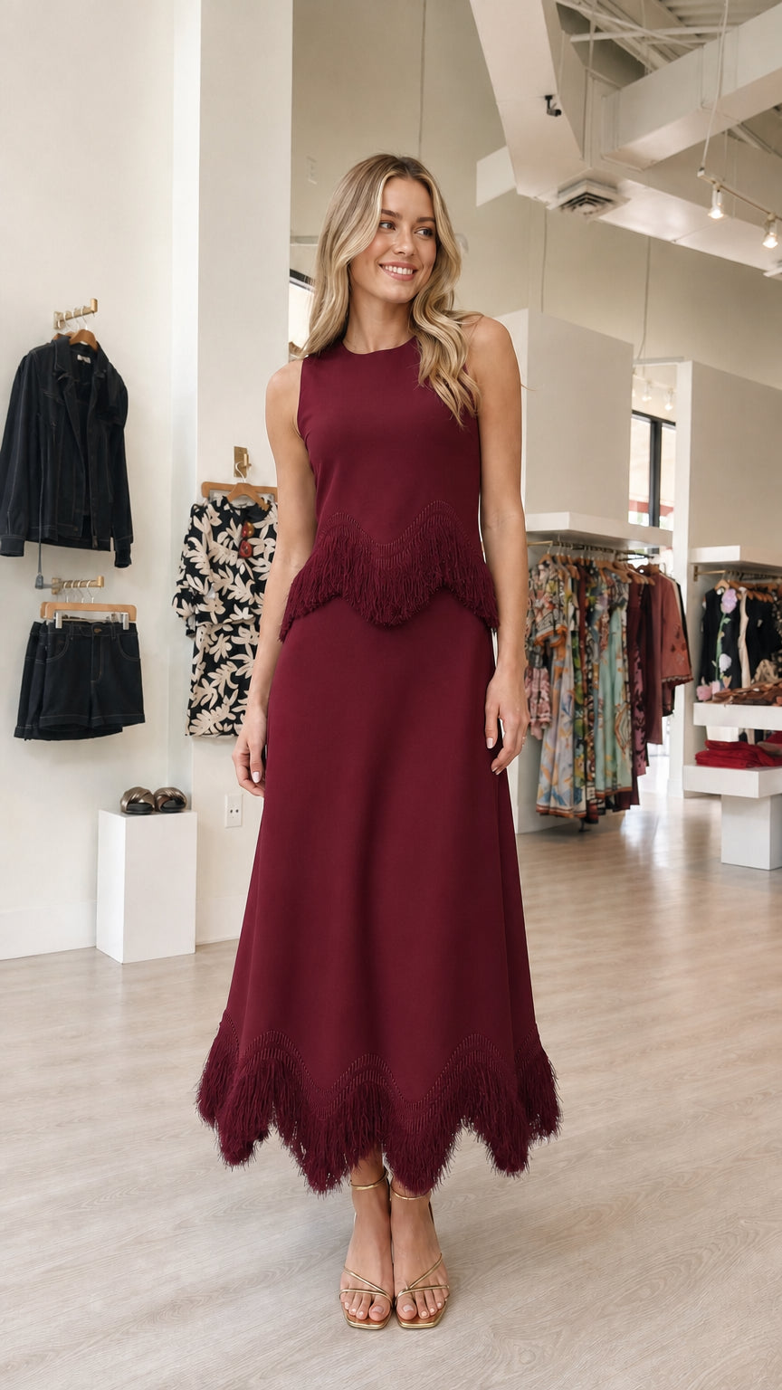 Model wearing burgundy fringe midi dress